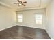Bedroom with two bright windows, a ceiling fan and trey ceiling adds character to the space at 610 Sunflower Dr, Canton, GA 30114