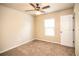 Cozy bedroom featuring a ceiling fan, neutral walls, carpet flooring and a window at 610 Sunflower Dr, Canton, GA 30114