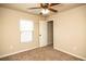 Bright bedroom features tan walls, carpet flooring, ceiling fan and a window at 610 Sunflower Dr, Canton, GA 30114