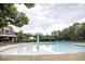 A spacious community pool area with mushroom water features and plenty of lounge chairs at 610 Sunflower Dr, Canton, GA 30114
