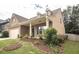 Well-maintained home with inviting front porch, complemented by lush landscaping and manicured lawn at 610 Sunflower Dr, Canton, GA 30114