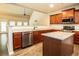 Open kitchen featuring granite counters, stainless steel appliances, and natural light at 610 Sunflower Dr, Canton, GA 30114