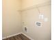 Laundry room featuring washer and dryer hookups, and wire shelving at 610 Sunflower Dr, Canton, GA 30114