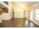 Spacious living room with high ceilings, wood floors, and natural light from large windows at 610 Sunflower Dr, Canton, GA 30114