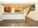 Living room featuring a breakfast bar overlooking the kitchen and staircase at 610 Sunflower Dr, Canton, GA 30114
