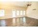 Bright living room with a door to the back, many windows and stylish ceiling fan at 610 Sunflower Dr, Canton, GA 30114