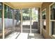 View of the screened-in porch with an outside view of the wooded backyard at 610 Sunflower Dr, Canton, GA 30114