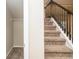 Staircase with carpet steps and a closet with shelving near the bottom of the stairs at 610 Sunflower Dr, Canton, GA 30114
