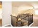 View of carpeted staircase with dark wood banister and railing leading to the upper level at 610 Sunflower Dr, Canton, GA 30114