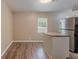 Bright, neutral kitchen space with stainless appliances, wood floors, and a breakfast bar at 881 Mercury Nw Dr, Atlanta, GA 30331
