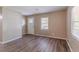 Bright living room with hardwood floors, a window, and a door leading outside at 881 Mercury Nw Dr, Atlanta, GA 30331
