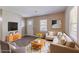 Inviting living room with a neutral color palette, cozy furniture, and ample natural light at 881 Mercury Nw Dr, Atlanta, GA 30331