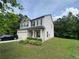Charming two-story home with a well-manicured lawn and an attached two-car garage at 12351 Styron Dr, Hampton, GA 30228