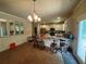 Open-concept kitchen with a breakfast bar, stainless steel appliances, and natural light at 12351 Styron Dr, Hampton, GA 30228