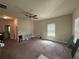 Spacious living room with cozy carpet and plenty of room for furniture at 12351 Styron Dr, Hampton, GA 30228