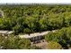 Overhead angle of the apartments and wooded grounds with the city in the background at 1445 Monroe Ne Dr # C13, Atlanta, GA 30324