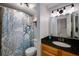 Bathroom featuring vanity with granite counters, marine-themed shower curtain, and light fixture at 1445 Monroe Ne Dr # C13, Atlanta, GA 30324