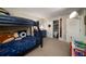 Bedroom featuring a bunk bed, blue dresser, closet, and toy storage at 1445 Monroe Ne Dr # C13, Atlanta, GA 30324