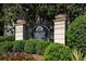 Elegant Carlyle Heights Condominium sign with beautiful landscaping and purple flowers at 1445 Monroe Ne Dr # C13, Atlanta, GA 30324