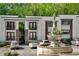 Modern condo building with a fountain and lush landscaping in a convenient location at 1445 Monroe Ne Dr # C13, Atlanta, GA 30324