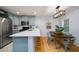 Bright eat-in kitchen features stainless steel appliances, quartz countertops, and a breakfast bar at 1445 Monroe Ne Dr # C13, Atlanta, GA 30324