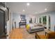 Bright living room with hardwood floors, stylish decor, and sliding doors to the outside at 1445 Monroe Ne Dr # C13, Atlanta, GA 30324