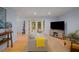 Bright living room with a modern TV, cozy seating, and large windows offering outdoor views at 1445 Monroe Ne Dr # C13, Atlanta, GA 30324