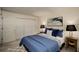 Inviting main bedroom with cozy bed, closet and bedside lamps with views from the window at 1445 Monroe Ne Dr # C13, Atlanta, GA 30324