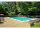 Relaxing community pool area featuring lounge chairs and well-maintained landscaping at 1445 Monroe Ne Dr # C13, Atlanta, GA 30324