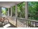 Cozy screened porch with a bicycle, providing a tranquil outdoor area surrounded by nature at 1445 Monroe Ne Dr # C13, Atlanta, GA 30324