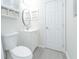 White bathroom with a sink, and a door provides a clean and functional space at 2125 Jessica Way, Lithonia, GA 30058
