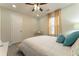 Well-lit bedroom with natural light, a fan, and neutral, calming decor at 2125 Jessica Way, Lithonia, GA 30058