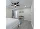Bright bedroom features a ceiling fan, wood floors, and a minimalist aesthetic for a calming retreat at 2125 Jessica Way, Lithonia, GA 30058