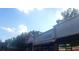 Exterior view of several storefronts including cleaners and restaurant with blue sky at 2125 Jessica Way, Lithonia, GA 30058