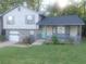 Charming two-story home with a stone facade, covered porch, and well-maintained front lawn at 2125 Jessica Way, Lithonia, GA 30058