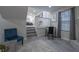 Living room space with a staircase, window, and comfortable seating at 2125 Jessica Way, Lithonia, GA 30058