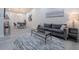 Open-concept living area with a dining space, modern furnishings, and vaulted ceilings throughout at 2125 Jessica Way, Lithonia, GA 30058