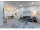 Bright living room with a vaulted ceiling, modern decor, and sleek furniture arrangement at 2125 Jessica Way, Lithonia, GA 30058