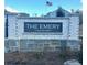 A brick and stone community sign with an American flag waving in the background at 311 Winton Way, Villa Rica, GA 30180