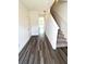 Inviting entryway with hardwood flooring and a staircase leading to the upper level at 311 Winton Way, Villa Rica, GA 30180