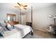 Bedroom with a four-poster bed, ceiling fan, and neutral paint at 3390 River Ferry Dr, Alpharetta, GA 30022