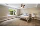 Comfortable bedroom featuring a ceiling fan, neutral tones, and a bright window at 3390 River Ferry Dr, Alpharetta, GA 30022