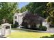 Elegant two-story home with beautifully landscaped front yard and a charming facade on River Ferry Drive at 3390 River Ferry Dr, Alpharetta, GA 30022