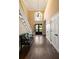 Grand foyer featuring high ceilings, hardwood floors, a staircase, and a view of the front entrance at 3390 River Ferry Dr, Alpharetta, GA 30022