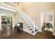 Spacious foyer featuring dark hardwood floors and a grand staircase at 3390 River Ferry Dr, Alpharetta, GA 30022