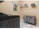 Functional laundry room with modern washer, storage shelves, a folding rack and a convenient organizational setup at 3390 River Ferry Dr, Alpharetta, GA 30022