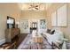 Elegant living room with soaring ceilings, built-in bookcases, and stylish decor, creating a sophisticated atmosphere at 3390 River Ferry Dr, Alpharetta, GA 30022