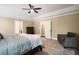 Spacious bedroom features plush carpeting, neutral walls, and ample natural light at 3390 River Ferry Dr, Alpharetta, GA 30022