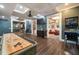 Basement recreation room with custom wall colors, a shuffleboard table, and game machines at 3390 River Ferry Dr, Alpharetta, GA 30022
