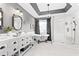 Elegant bathroom featuring a standalone tub, dual vanities, a chandelier, and a glass-enclosed shower at 4527 Village Springs Run, Dunwoody, GA 30338